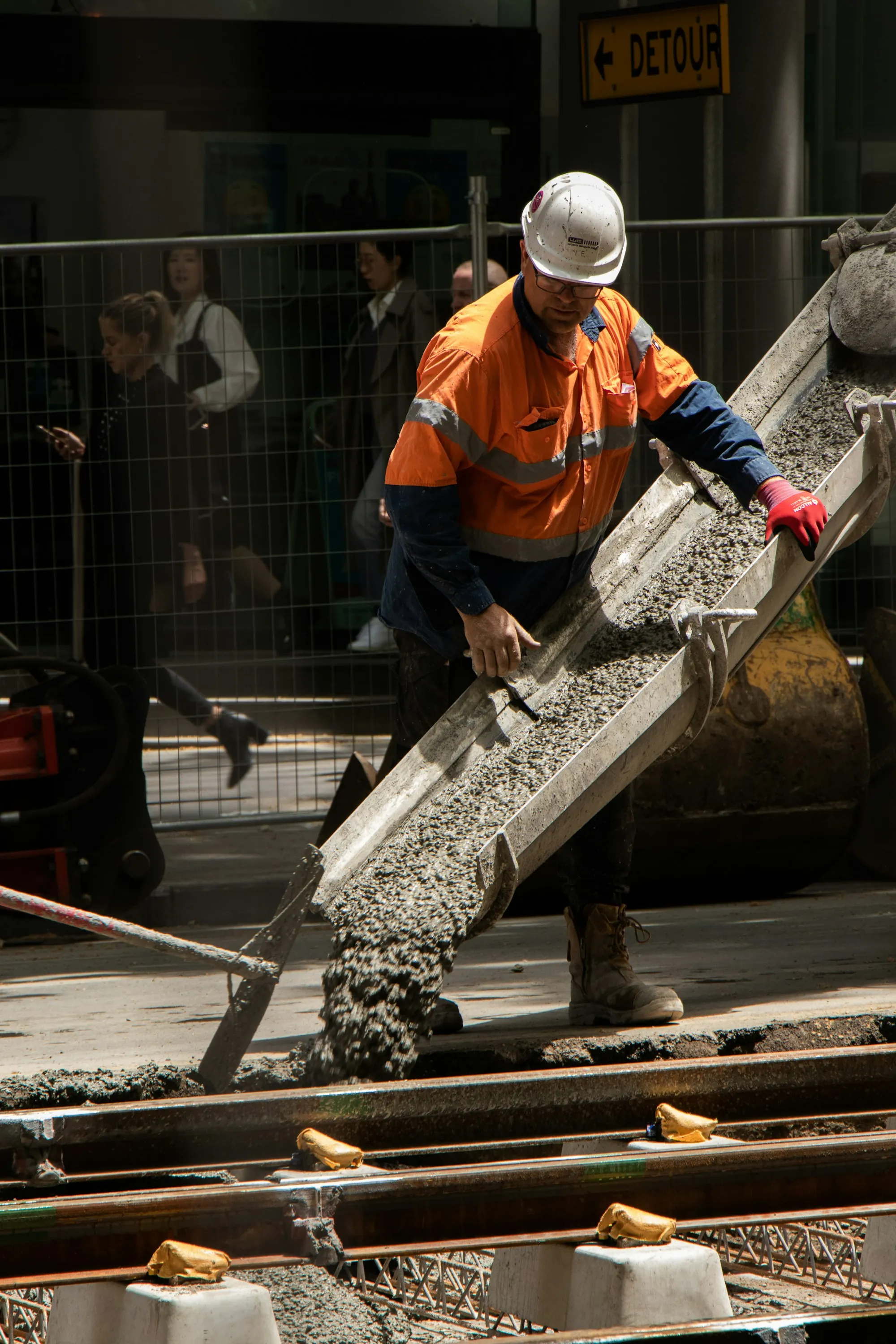 Wet concrete sliding down a mixer chute