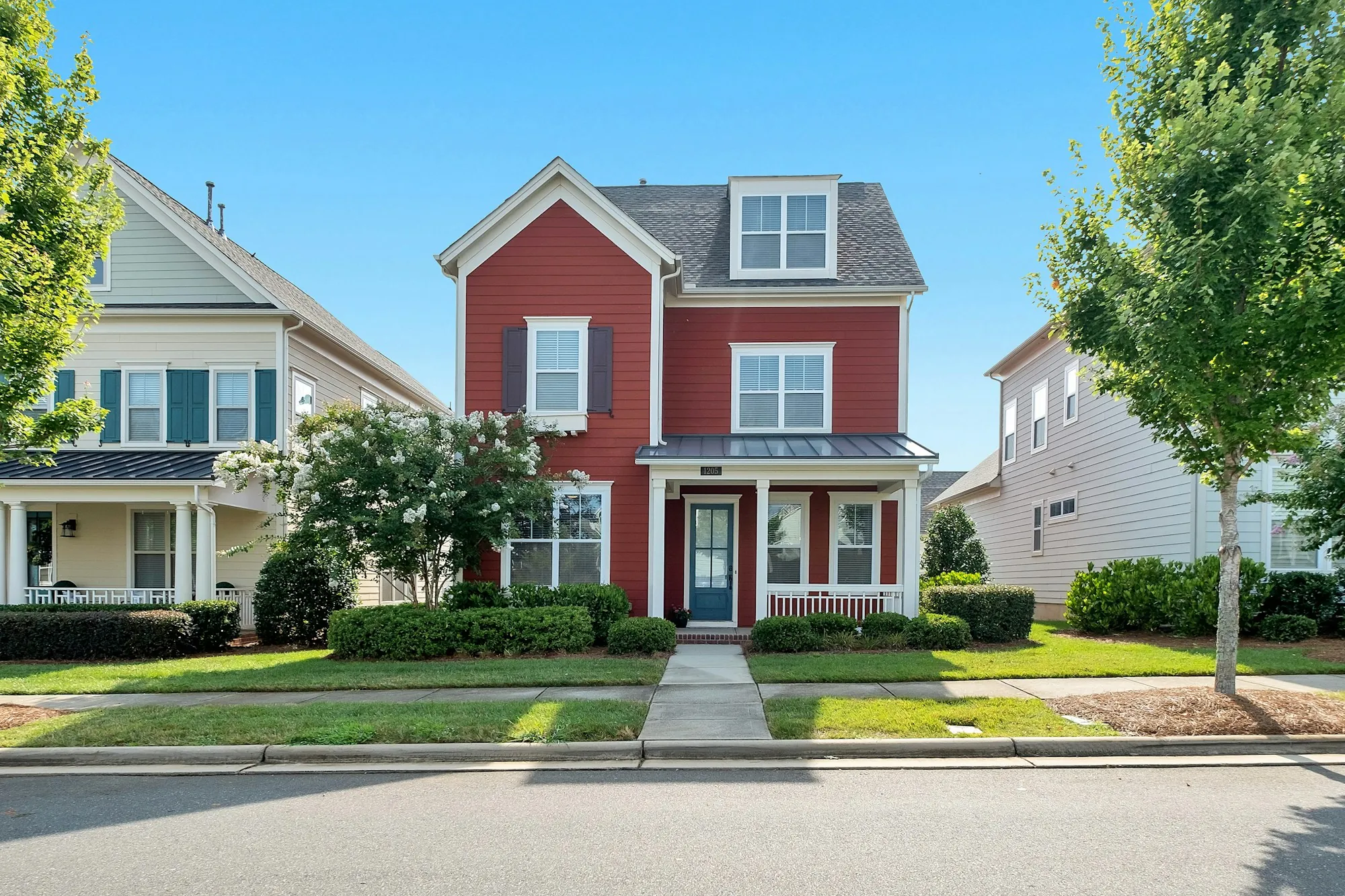 Row of homes with front walks to the sidewalk